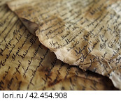 Old parchment paper with illegible writing on it,    Generative AI. Стоковое AI-изображение, AI-художник Анна Кривицкая / Фотобанк Лори
