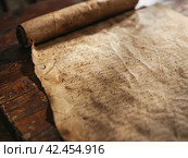 Old parchment paper with illegible writing on it,    Generative AI. Стоковое AI-изображение, AI-художник Анна Кривицкая / Фотобанк Лори