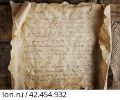 Old parchment paper with illegible writing on it,    Generative AI. Стоковое AI-изображение, AI-художник Анна Кривицкая / Фотобанк Лори