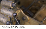 Internal clock mechanism. Impact watch hammers driven by clockwork. Macro shot. Стоковое видео, видеограф EStarodubov / Фотобанк Лори