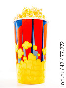 Popcorn in striped bucket. Стоковое фото, фотограф Сергей Толмачёв / Фотобанк Лори