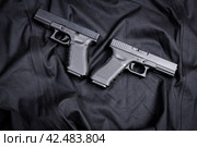 handgun on black background. Стоковое фото, фотограф Сергей Толмачёв / Фотобанк Лори