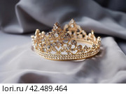 Royal gold tiara with shining gems. Generate ai. Стоковое AI-изображение, AI-художник Иван Рябоконь / Фотобанк Лори