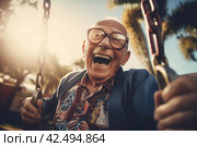 Elderly man having fun on swing. Generate ai. Стоковое AI-изображение, AI-художник Иван Рябоконь / Фотобанк Лори