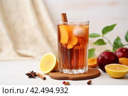 Glass of refreshing tamarind drink and fresh fruits. Generate Ai. Стоковое AI-изображение, AI-художник Иван Рябоконь / Фотобанк Лори