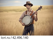 Handsome country singer cowboy hat in wheat field. Generate ai. Стоковое AI-изображение, AI-художник Иван Рябоконь / Фотобанк Лори
