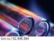 Closeup shot of glass tubes in colorful lights. Generate ai. Стоковое AI-изображение, AI-художник Иван Рябоконь / Фотобанк Лори