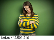 Beautiful but sad woman posing on green background. Generate ai. Стоковое AI-изображение, AI-художник Иван Рябоконь / Фотобанк Лори