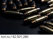 Heap of bullets on dark background. Generate ai. Стоковое AI-изображение, AI-художник Иван Рябоконь / Фотобанк Лори