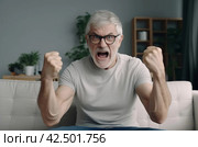 Happy senior man with raised hands. Generate ai. Стоковое AI-изображение, AI-художник Иван Рябоконь / Фотобанк Лори