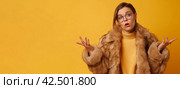 Puzzled hesitant young Caucasian woman in fur coat banner. Generate ai. Стоковое AI-изображение, AI-художник Иван Рябоконь / Фотобанк Лори