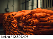 Orange robe prisoners heap clothes. Generate ai. Стоковое AI-изображение, AI-художник Иван Рябоконь / Фотобанк Лори