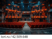Rundown vintage theatre auditorium with red velvet seats and and ornate proscenium arch. Стоковое AI-изображение, AI-художник Юрий Поздников / Фотобанк Лори