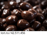 Chocolate covered dried raisins delight. Generate ai. Стоковое AI-изображение, AI-художник Иван Рябоконь / Фотобанк Лори