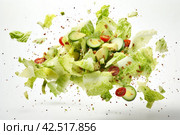 Dramatic Caesar salad falling. Generate Ai. Стоковое AI-изображение, AI-художник Иван Рябоконь / Фотобанк Лори