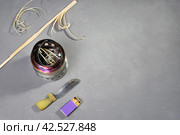 burner for picnics outdoors, knife and matches, for prepare ignition wooden shavings with copy space. Стоковое фото, фотограф Vladimir Vikhrov / Фотобанк Лори
