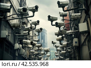 Intrusive Lots cctv security cameras. Generate Ai. Стоковое AI-изображение, AI-художник Иван Рябоконь / Фотобанк Лори