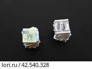 Стопка предметов в виде долларов и евро. Стоковое фото, фотограф Vladimir Vikhrov / Фотобанк Лори