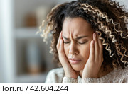 Woman with severe headache. Стоковое AI-изображение, AI-художник Данил Руденко / Фотобанк Лори