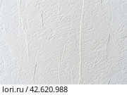 Paper wrinkle background. Texture of luxury white regular paper, capturing the subtle fibers and surface irregularities typical of standard paper. Closeup. Designs decoration, nature backdrop concept. Стоковое AI-изображение, AI-художник Марина Демидюк / Фотобанк Лори