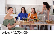 At home party, young Asian woman appearing offended and upset during argument while female friends in background showing disapproval and discontent. Стоковое видео, видеограф Яков Филимонов / Фотобанк Лори