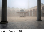 View of the courtyard and the place for ritual ablution of the Chamlyja Mosque on a foggy day, Istanbul, Turkey. Стоковое фото, фотограф Ula Ulachka / Фотобанк Лори