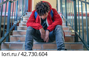 Sad Schoolboy on the Steps: Suffering from Bullying. Стоковое AI-изображение, AI-художник Юрий Поздников / Фотобанк Лори