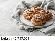 Cinnamon buns on a Scandi table. Image for cafe menu, Banner. Стоковое AI-изображение, AI-художник Ирина Ручушкина / Фотобанк Лори