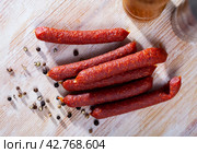 Appetizing tyrolean sausages on wooden table. Стоковое фото, фотограф Яков Филимонов / Фотобанк Лори