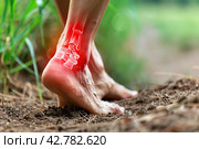 Barefoot walking on nature walking outdoors. Bare foots with red effect of pain. Painful gout inflammation. Tingling, burning sensation in foot. Sensory neuropathy problems. Healthcare, podiatry. Legs. Стоковое AI-изображение, AI-художник Марина Демидюк / Фотобанк Лори
