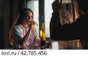 During a family argument, the husband yells at his wife and she drinks too much wine. Стоковое видео, видеограф Strunov David / Фотобанк Лори