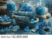 Items that are often associated with meditation, esotericism or relaxation practices. In the center of the frame is a wooden bowl filled with bright blue crystals, likely lapis lazuli stones. To the left of the bowl are bundles of cloth and herbs, similar to resins or smoking sticks, that can be used for space cleansing or aromatherapy. Smoke from the resin floats above the bowl, giving the scene a mystical atmosphere. The background is made up of antique vases and natural wood, which emphasizes the naturalness and traditionality of the scene. Стоковое AI-изображение, AI-художник Анна Кривицкая / Фотобанк Лори