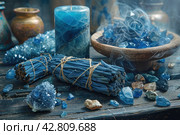 Items that are often associated with meditation, esotericism or relaxation practices. In the center of the frame is a wooden bowl filled with bright blue crystals, likely lapis lazuli stones. To the left of the bowl are bundles of cloth and herbs, similar to resins or smoking sticks, that can be used for space cleansing or aromatherapy. Smoke from the resin floats above the bowl, giving the scene a mystical atmosphere. The background is made up of antique vases and natural wood, which emphasizes the naturalness and traditionality of the scene. Стоковое AI-изображение, AI-художник Анна Кривицкая / Фотобанк Лори