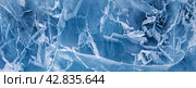 Abstract background of natural winter ice surface. Panoramic wide view from above of ice texture of frozen Baikal Lake. Natural pattern of crack lines and blue and white spots. Flat lay, banner, mock up. Стоковое фото, фотограф Виктория Катьянова / Фотобанк Лори