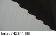 Water flows from the roof of a house during a thunderstorm. Стоковое видео, видеограф Igor Skripachev / Фотобанк Лори