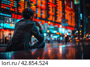 A man in a business suit looks thoughtfully at the busy streets of the city with bright neon lighting. This image is full of atmosphere and can be interpreted as a moment of reflection on life's journey or as a break from the fast pace of modern life. Стоковое AI-изображение, AI-художник Анна Кривицкая / Фотобанк Лори