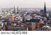 Aerial city view with spire of St. Nicholas Church on the right side (2018 год). Редакционное фото, фотограф EugeneSergeev / Фотобанк Лори