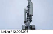 Moscow 14 April 2024, Close-up of 5G hundredth towers. Cellular Signal Repeater Mounted on Poles. Operation and repair of cell towers, Stable. Installing Signal Transmitters. Редакционное фото, фотограф Скрипачев Антон / Фотобанк Лори