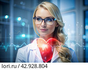 Medicine a young beautiful girl is a cardiologist with glasses in an office with a stethoscope. Red numeric codes in the form of a heart rhythm on a virtual screen. Digital technologies of the future. Стоковое AI-изображение, AI-художник Photojuli / Фотобанк Лори