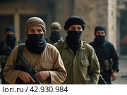 Terrorists with a machine gun on the background of military operations.Isis is a terrorist. Стоковое AI-изображение, AI-художник Александр Поташев / Фотобанк Лори