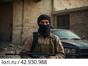 Terrorists with a machine gun on the background of military operations.Isis is a terrorist. Стоковое AI-изображение, AI-художник Александр Поташев / Фотобанк Лори