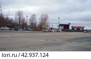 Petrozavodsk, Karelia, Russia, April 18, 2024: restaurant Fregat Frugate, River Station, Park of Culture and Leisure, amusement park, embankment of Lake Onega. A man rides scooter. Karl Marx Avenue. Редакционное видео, видеограф Юлия Петровская / Фотобанк Лори