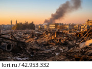 The aftermath of the bombing in the city of israel reveals a haunting scene of devastationThe once vibrant streets are now filled with rubble and charred remnants of buildingsThe destruction is overwhelming, as entire structures have been reduced to mere. Стоковое AI-изображение, AI-художник Александр Довянский / Фотобанк Лори