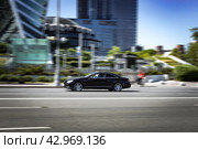 Black luxury Mercedes CL car in motion. Mercedes-Benz CL 65 AMG V12 Bi-Turbo. Редакционное фото, фотограф Константин Григорьев / Фотобанк Лори