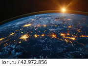 Nightly planet Earth in dark outer space. Civilization. Elements of this image furnished by NASA. Стоковое AI-изображение, AI-художник Ирина Михайличенко / Фотобанк Лори