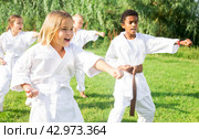 Kids in kimono doing kata moves. Стоковое фото, фотограф Яков Филимонов / Фотобанк Лори
