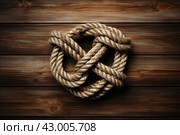 Intricate Marine knot on wooden background. Generate AI. Стоковое AI-изображение, AI-художник Иван Рябоконь / Фотобанк Лори