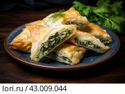 Flaky Spanakopita greek pastry. Generate Ai. Стоковое AI-изображение, AI-художник Иван Рябоконь / Фотобанк Лори