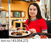 Woman eating in catalan restaurant. Стоковое фото, фотограф Яков Филимонов / Фотобанк Лори