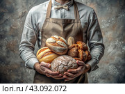 Fresh delicious bread in the hands of a male baker in close-up. Freshly baked sourdough bread with a golden crust on a wooden board. The context of a bakery with delicious bread. Confectionery products. Стоковое AI-изображение, AI-художник Photojuli / Фотобанк Лори